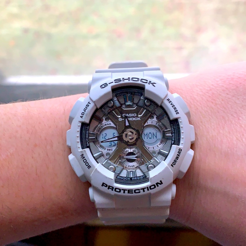 Women’s G-shock watch. White/light gray with silver face.